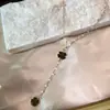Bestseller transfronterizo: Collar de borlas en forma de Y de margarita para mujer, lujo ligero con un toque de alta gama, nicho y no se decolora