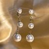 Clip para la oreja sin agujero para la oreja para mujer, aretes retro con borla, aretes de perlas de alto sentido, clip para la oreja de temperamento de lujo ligero al por mayor
