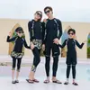 Traje de buceo para padres e hijos de Corea del Sur, traje de baño de manga larga con medusas para parejas, cremallera dividida, pantalones de protección solar, traje de snorkel, adelgazante