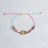 Europa y Estados Unidos transfronterizo superventas carcasa de aleación pintada con goteo de aceite pulsera de cerámica suave cuerda de mano tejida con conchas estilo playa ajustable