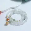 Pulsera Esmeralda Tianshan Nuevo Estilo Chino Estilo Nacional Joyería Natural Xinjiang Seda Dorada Jade Jade Jade Color Flor Flotante Pulsera de Jade