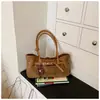 Bolsos de diseño de nicho transfronterizos para mujer, nuevos bolsos casuales retro de alta gama para otoño 2026, bolsos de hombro y para el antebrazo