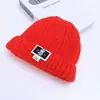 Gorro de punto para niños, engrosado con hilo grueso para otoño e invierno, con una etiqueta de tela de dibujos animados, diseño unisex y un estilo cálido para poner, adecuado para ventas transfronterizas