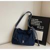 Bolsa de mezclilla con cordón de gran capacidad para mujer 2025 Nueva tendencia Nicho Simple Bolso de hombro Versátil Bolsa de compras para ir al trabajo