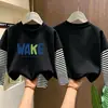 Camiseta de manga larga para niño 2026 nueva ropa de otoño para niños, camiseta básica de algodón puro de imitación de dos piezas para niño, top para niños mayores