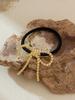 Anillo para el Pelo de Metal con Forma de Lazo Transfronterizo Nuevo Diseño de Nicho Lujo Ligero Tendón de Goma Cuerda para la Cabeza de Cola de Caballo Baja para Mujer