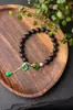 Anillo auténtico de Jiangzhen, de grado Qinan, de Hainan, con aceite negro, hecho a mano, para hombres y mujeres.