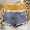 Muchas nuevas calzoncillos de hombre ajustados rayas multicolor cintura simple niños transpirables boxers una generación de pelo