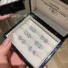 Venta al por mayor de fábrica suministro en vivo aretes de plata s925 incrustados con material natural peligroso jadeíta verde yang azúcar pequeños frescos para mujer