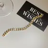 Pulsera con cierre de pinza empalmada con circonita chapada en oro real de 18k, conjunto de pendientes y anillo, pulsera de nicho de lujo ligero, accesorio versátil
