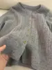 Cárdigan de punto grueso estilo europeo minimalista con trenzas, cuello redondo para mujer, versátil para otoño e invierno, estilo perezoso, suéter suave con botones dorados