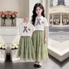 2026 Nuevo Estilo Universitario Verano Top de Manga Corta Estilo Delgado para Chicas Casual Dulce Lazo Falda Larga Conjunto de Dos Piezas