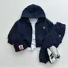 Colección de otoño nueva hecha a medida: Ropa de estilo coreano para niños y bebés, incluyendo sudaderas con cremallera, sudaderas con capucha y pantalones largos para niños y niñas.