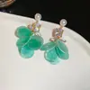 Pendientes de borla de flor de cuentas de color dopamina para primavera, sensación de lujo ligero y alta gama, pendientes atmosféricos estilo vacacional para mujer