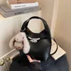 Bolso de mano pequeño de moda con estampado de lichi transfronterizo para mujer, nueva colección 2026, bolso tote para el trabajo, bolso tipo cubo, bolso cruzado moderno y elegante