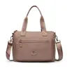 2026 de alta gama, moda nicho, bolso de hombro versátil, color sólido, bolso tote simple, bolso de mano de moda versátil