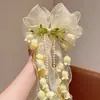 Novo Estilo de Primavera Laço Flor de Lírio do Vale Doce e Fofo Acessório de Cabelo para Meninas, Adequado para Uso Diário e Trajes Tradicionais, com Presilha de Cabelo com Fita Longa
