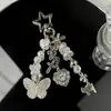 Estilo Y2K Milenio Accesorios de Mariposa Bolso Colgante Estrella de Cinco Puntas Cadena para Teléfono Oso con Cruz Llavero de Perlas