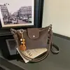 Bolsa Nanfeng da moda e de alta qualidade, outono e inverno de 2026, grande capacidade, popular, comércio exterior transfronteiriço, live-streaming, bolsa de ombro cruzado em camurça