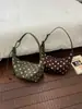 Bolso de Axila de Lunares Fresco y Dulce para Mujer 2026 Principios de Otoño Elegante Bolso de Albóndiga Plegado de Nicho Bolso de Hombro Único Versátil para el Trabajo