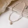 Collar con colgante de cuentas retorcidas de doble capa estilo francés para mujer, nuevo modelo 2026, cadena para la clavícula, accesorio de lujo ligero y de alta gama