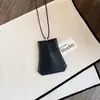 Nuevo collar llavero geométrico de cuero estilo europeo y americano con diseño único, cadena versátil para suéter de uso diario para mujer