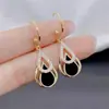 2026 Moda Japonesa e Coreana Novos Brincos Pretos de Gota d'Água Vazados com Design Único em Estoque
