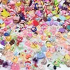 Accesorios de resina de dibujos animados mixtos al por mayor, accesorios DIY para cuerdas de pelo, accesorios de pegamento de crema de resina, materiales DIY para pasadores por libra