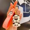 Llavero creativo con forma de panda de moda nacional con dibujos animados de celebridades de Internet auténticos, lindo colgante para bolso de estudiante, venta al por mayor