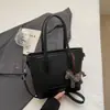 Bolso de mano tipo cubo nuevo de primavera 2026, transfronterizo, estilo vintage simple, de alta gama, moderno, para ir al trabajo, bolso de hombro cruzado de moda