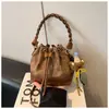 Bolsa de Mujer 2026 Coreana de Nicho de Alto Valor Estética Bolso Cubo Bolso de Mano Estilo Melard Retro Bolso de Hombro Cruzado para Mujer
