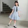 Vestido de Verano para Niñas 2026 Nuevo Elegante Estilo Universitario Vestido Camisa a Cuadros con Cuello Polo para Niños Mayores Moderno