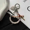 Cadena de hueso de serpiente de cable telefónico nueva y creativa con lazo personalizado, decoración versátil para bolso y accesorio para funda de teléfono