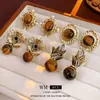 Pendientes Vintage de Segunda Mano Aguja de Plata Incrustada con Diamantes Flor Antigua Pendientes de Piedra Ojo de Tigre Pendientes de Moda Retro de Alta Gama