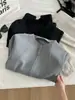 Chamarra con cuello alto y cierre estilo coreano minimalista de algodón al aire para mujer, colección otoño 2026, elegante y estilizada, cárdigan sudadera versátil