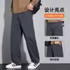 Pantalones casuales nuevos de otoño con múltiples bolsillos para hombre, corte holgado, versátiles, con caída, resistentes a las arrugas, estilo de pierna recta