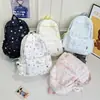 Mochila nueva de estilo bosque, alta apariencia, fresca, dulce y linda con estrellas, para estudiantes de secundaria y preparatoria, bolsa ligera y simple de doble hombro