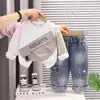 Ropa Infantil 2026 Primavera y Otoño Nuevo Estilo Sudadera Elegante para Niños con Bolsillos Diagonales Conjunto de Dos Piezas Ropa Deportiva Holgada Atuendo de Primavera Moderno