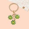Llavero pequeño con colgante especial transfronterizo, bonito y pequeño accesorio con flores frescas, llavero de metal para colgar en el bolso.