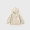 Otoño 2026 Nuevo Color Sólido Moda Brillante Principios de Otoño Sudadera Cómoda para Niños Holgada Moderna con Capucha Top para Niños