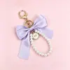 Llavero de Nudo de Lazo Colorido con Perlas, Colgante de Satén de Alta Gama para Bolsos de Niñas, Accesorio de Cadena para Teléfono, Pequeño Regalo Exquisito
