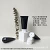 Botella vacía subenvasada de 50 g con tapa abatible negra esmerilada para limpiador facial de aminoácidos para hombres.