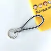 Llavero de cuerda trenzada de doble anillo, llavero de cuero PU colorido, nuevo colgante para bolso de mujer, llavero para colgar en la cintura