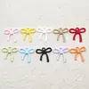 Accesorios colgantes de lazo coloridos de aleación pintados en spray para pulseras, collares, pendientes y otras joyas de bricolaje