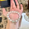 Pulsera de Piedra Ojo de Gato Imitación, Diseño de Nicho, Accesorio de Mano Simple y Elegante para Mujer, Nueva Pulsera de Alta Gama de Moda 2026