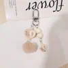 Llavero Creativo de Audífono Bádminton Colgante de Raqueta Moda Llavero de Coche Bolsa de Regalo Colgante de Labial para Mujeres