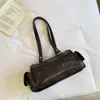 Bolsa Pequena de Cor Sólida com Personalidade 2026 Outono Nova Retro Design de Nicho Feminina Sensação Relaxada Bolsinha de Mão Cilindro Redondo Tendência