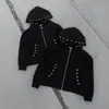 Nueva colección de otoño e invierno: Chamarra sudadera holgada y elegante con cremallera de anillo metálico y un diseño único perforado