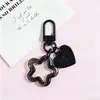 Llavero con hebilla de puerta giratoria, colgante de pentagrama y corazón transparente de colores, accesorio hecho a mano para bolsos