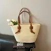 Bolsa tejida de estilo nuevo para la primavera de 2026, bolsa de playa de paja, de un solo hombro, estilo vacacional pastoral francés, bolsa grande para mujer